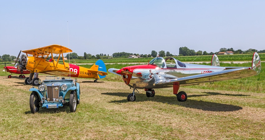 2 vintage planes and one vintage car