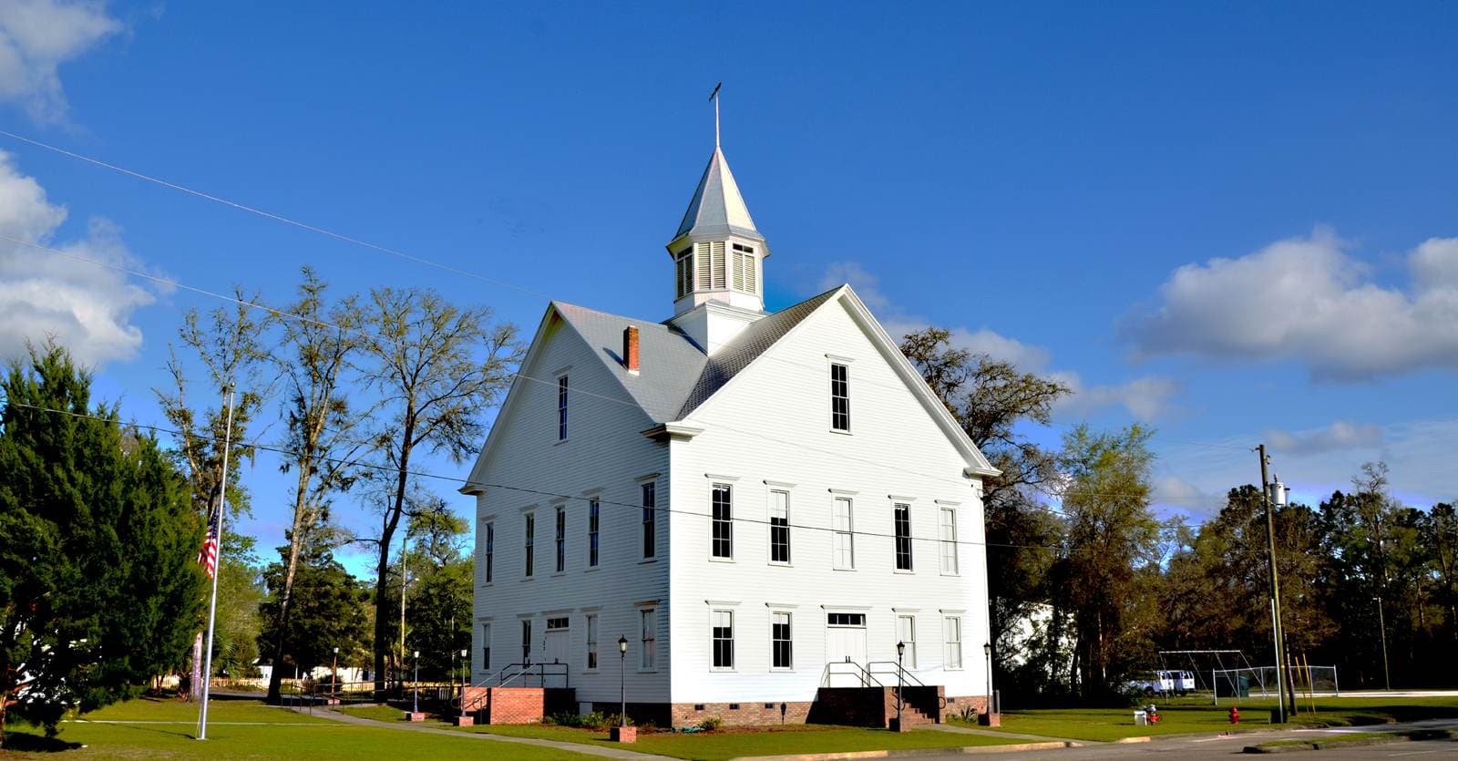 Image of a white church on grass