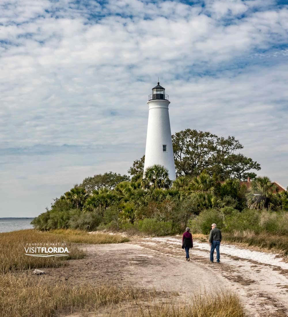 Image of St. Marks Lighthouse with two people walking up to it